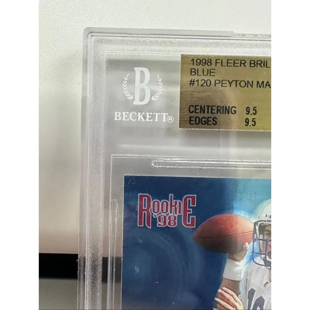 1998 Peyton Manning Fleer Brilliant Blue Rookie card. Beckett 9.5